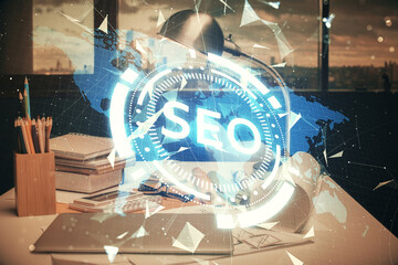 Double exposure of SEO drawing and office interior background. Concept of Search optimization engine.