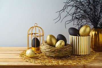 Easter holiday concept with Easter eggs decor in black and golden colors on wooden table