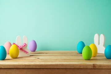 Wooden table with Easter eggs. Background for product display mock up.