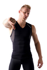 Disappointed or displeased athletic young man doing thumb down sign