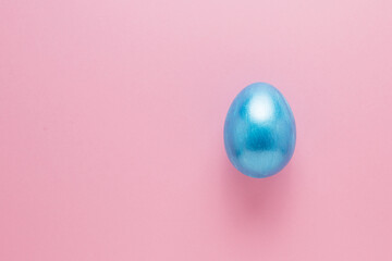 Multi-colored Easter eggs on a pink isolated background. Easter is a bright holiday.