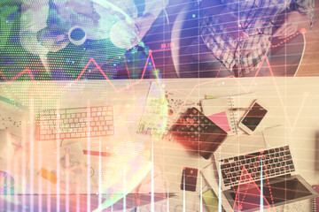 Double exposure of man and woman working together and financial chart hologram drawing. market analysis concept. Computer background. Top View.