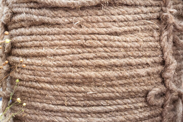 Close-up of coarse linen fiber rope. Textures with rough rope