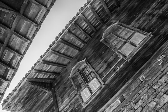 Old traditional houses in Zheravna, Bulgaria. The village is an architectural reserve of Bulgarian National Revival period (18th and 19th century). Black and white photography.