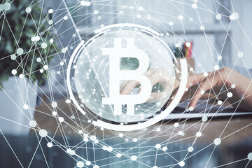 Double exposure of woman hands typing on computer and crypto market theme hologram drawing. Blockchain concept.