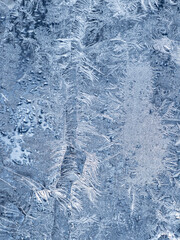 Ice crystals in the detail on a window glass in winter time