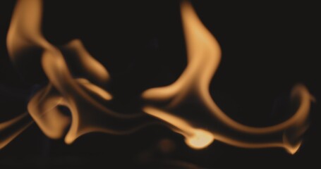 Fire dancing against dark background
