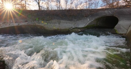 Large sewage tunnel with filth flowing out