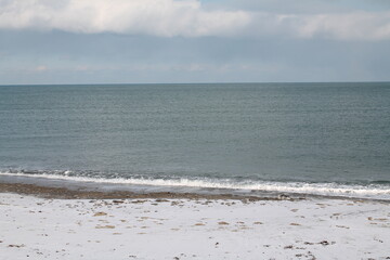 Blue waves on the blue sea. Sea shore. Sand. Summer.
