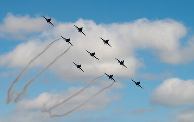 Indian Air Force Surya Kiran Aerobatic Team performs at an air show 