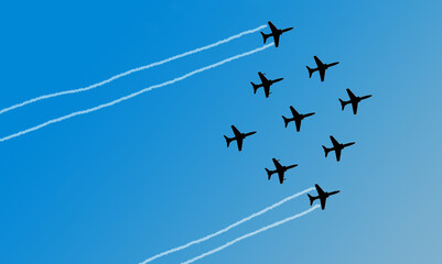 Indian Air Force Surya Kiran Aerobatic Team performs at an air show 