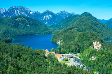 Hohenschwangau Castle next to the lakes Schwansee and Alpsee, embedded within a beautiful and...