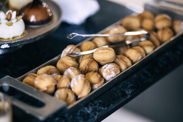 nuts in the form of sweet cookies on a gray cement background, concept of food, celebration.