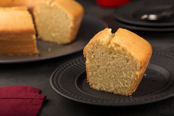 Homemade cake on a dark background.