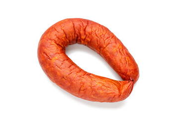 Smoked sausage ring with spices and herbs isolated on white background.