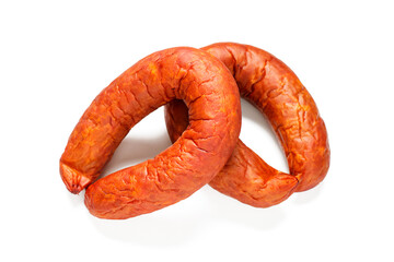 Smoked sausage ring with spices and herbs isolated on white background.
