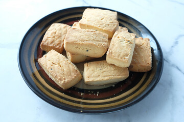 close up of sweet cookies on wooden table 