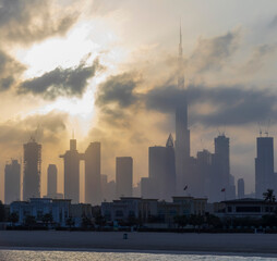 Dubai, UAE - 03.06.2021 Dubai public beach with city skyline on background.Sunrise hour. Outdoor