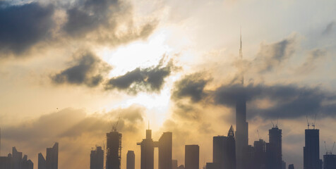 Obraz premium Dubai, UAE - 03.06.2021 Dubai public beach with city skyline on background.Sunrise hour. Outdoor
