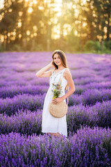 Beautiful girl in lavender. Cute girl on a purple background.