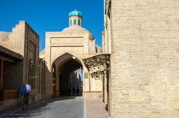 narrow ancient street of middle east town in summer heat 