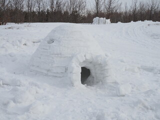 real igloo on the snow, winter cloudy day