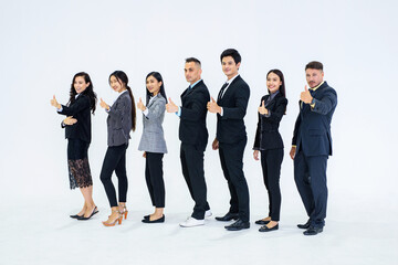 Obraz premium Full picture of professional staff with thumbs up and looking to the left of the picture.