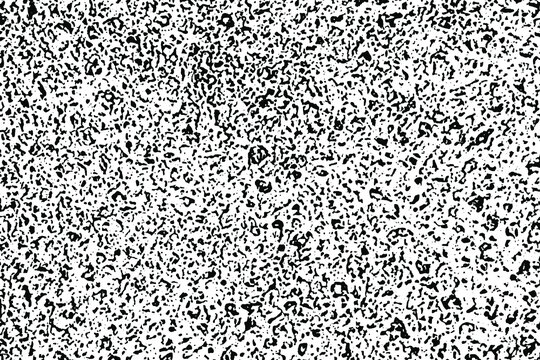 Grunge mottled texture of an old organic surface. Monochrome natural background of irregular chaotic spots, noise and graininess. Overlay template. Vector illustration