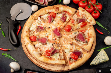 delicious meat pizza on a stone background
