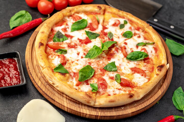 Pizza Margherita on a stone background 