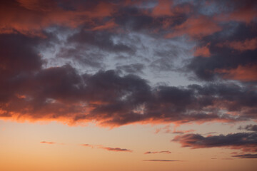 Fototapeta na wymiar Red sunrise sky. Orange morning light. Dramatic clouds