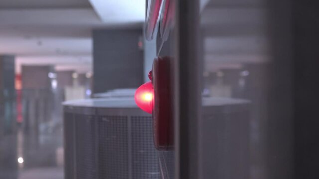 Close-up on fire fighting equipment in modern building. The lens shakes slightly. Truck shot from right to left.
