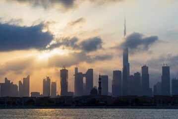 Obraz premium Dubai, UAE - 03.06.2021 Dubai public beach with city skyline on background.Sunrise hour. Outdoor