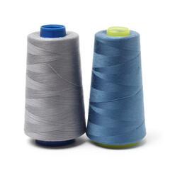 spools of thread for the textile industry on white background