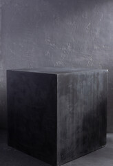 Grey cube near painted background texture as abstract. Architecture concept of minimalism design