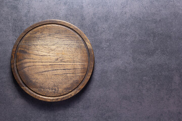 Meat or bread cutting board for homemade baking on table. Food recipe concept at stone background