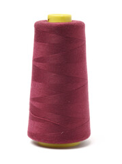 spools of thread for the textile industry on white background