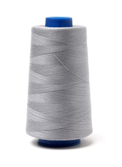 spools of thread for the textile industry on white background