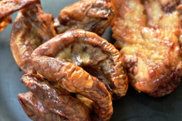 roasted pork neck and innards on plate dipping with tamarind sauce