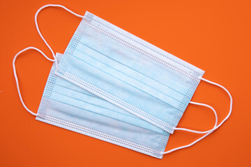 two medical masks on colorful background