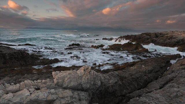 Waves crashing against shore at Gans Bay, South Africa