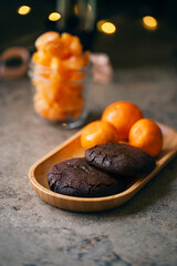 Chocolate chip cookies. Sweet dark biscuits with chocolate and tangerines.