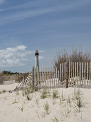 The famous Cape May Lighthouse on Cape May beach seen from the beach