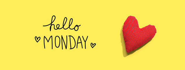 Hello Monday message with a red heart cushion - flat lay