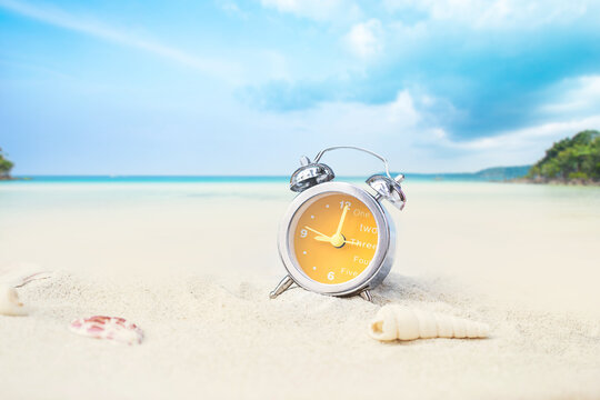 last minute to count down for travel or travel vacation concept. metaphor by old retro clock on sand beach.