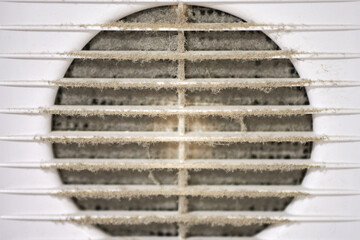 Dirty air ventilation grill of HVAC with clogged filter.