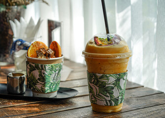 dessert for summer time, ice-cream and passion fruit smoothy time on the wood desk