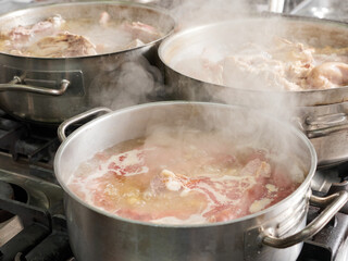 kitchen pots with stew boiling
