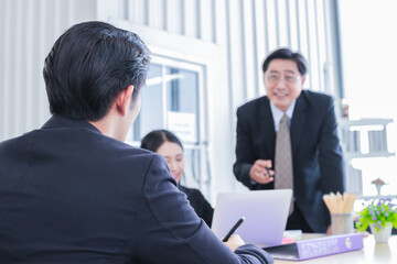 asian group meeting business people. Senior tranning Asian Businessman. Group discussion. Happy faces of suitma. Working for success in office.