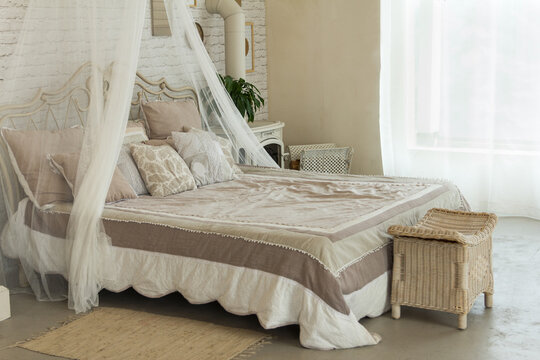Beautifully furnished bedroom, bed with pillows and baldachine